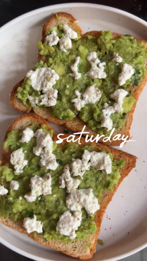 Close-up of creamy avocado toast with poached egg on whole grain bread