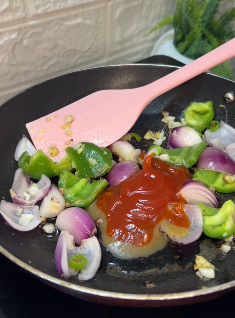 Flat lay of homemade chili dumplings arranged on a bamboo steamer