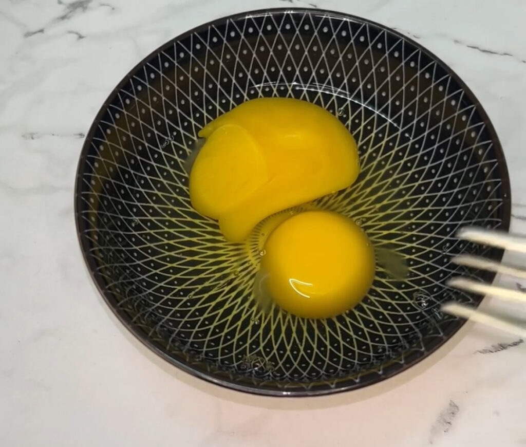 Golden-brown Spanish omelet recipe served with fresh herbs on a plate