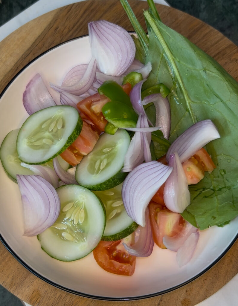 Healthy bowl of fresh Mediterranean salad with lemon dressing