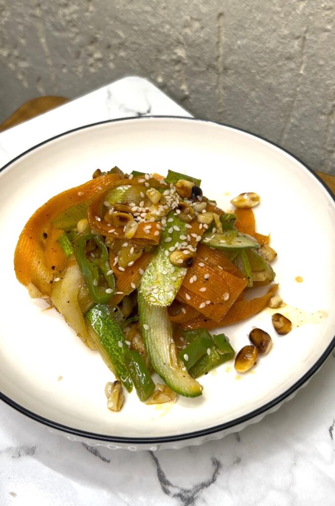 Light and healthy easy Asian cucumber noodle salad with chili flakes and a soy dressing