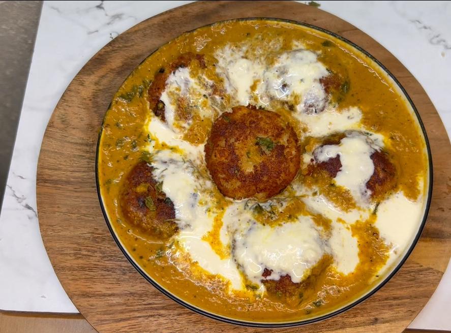 Bowl of One‑pot creamy tofu curry garnished with fresh cilantro