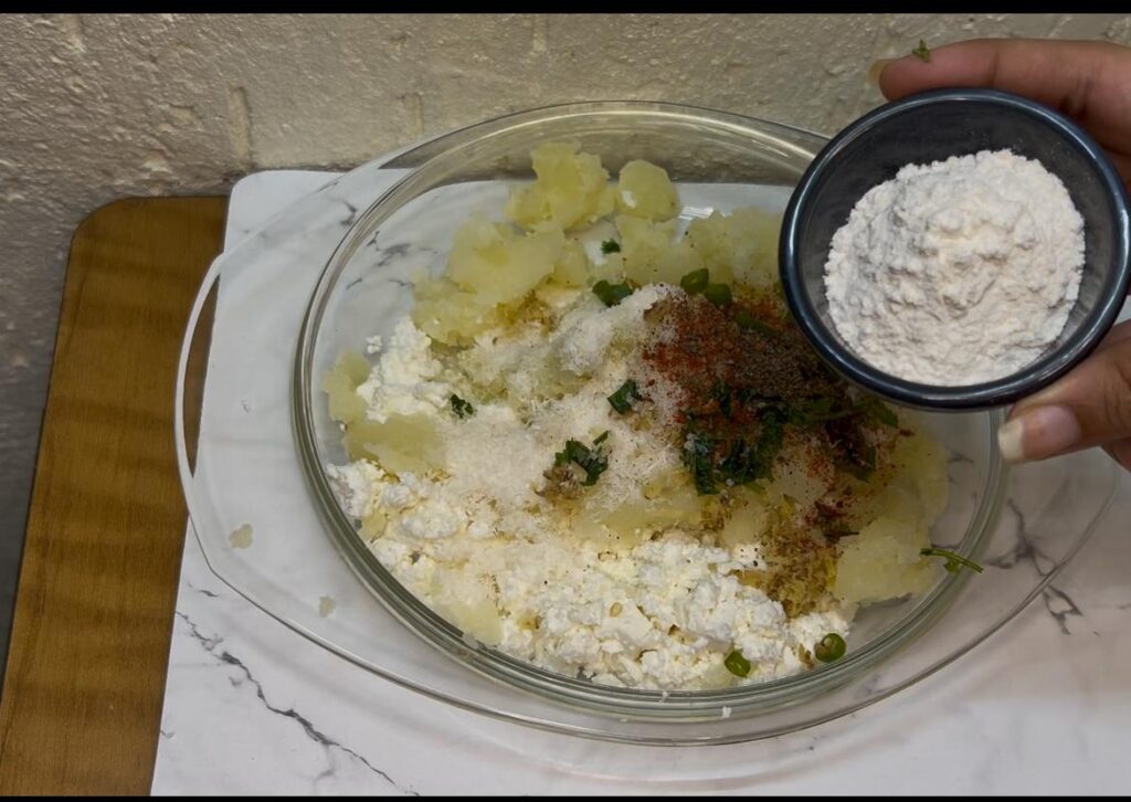 Top-down view of creamy tofu curry served with rice in a white bowl