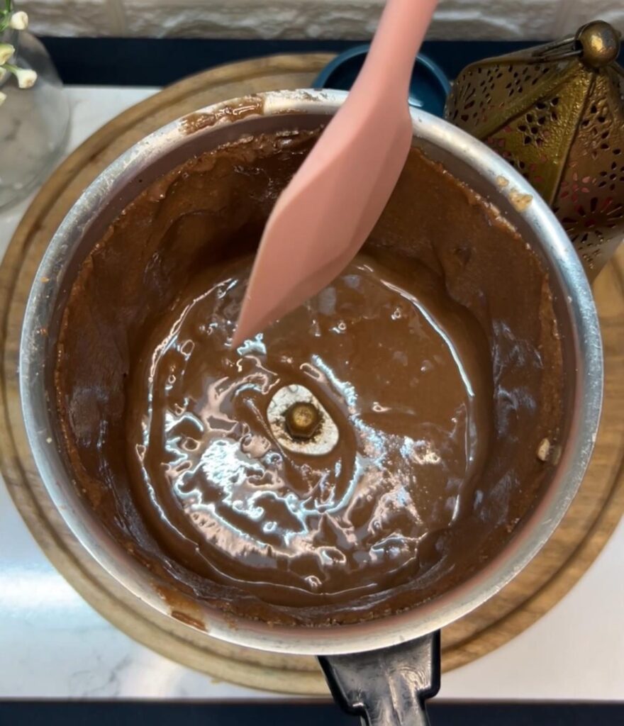 Spreading homemade Nutella on a slice of toast