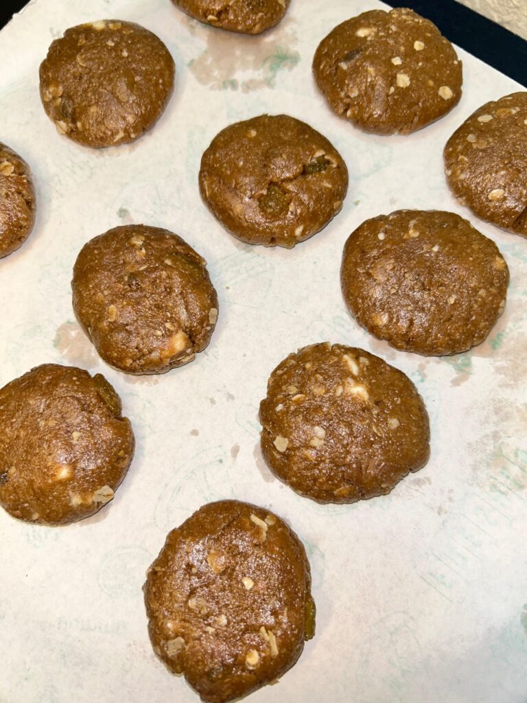 Homemade oatmeal raisin cookies cooling on a wire rack


