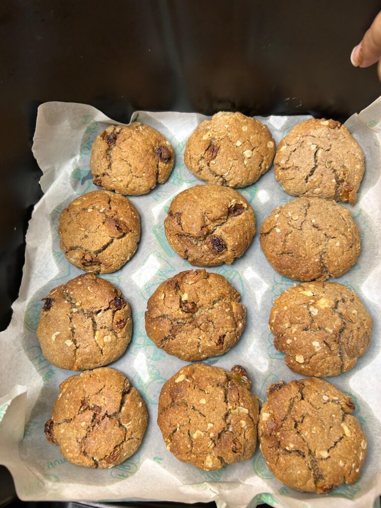 Ingredients for oatmeal raisin cookies laid out on a kitchen counter