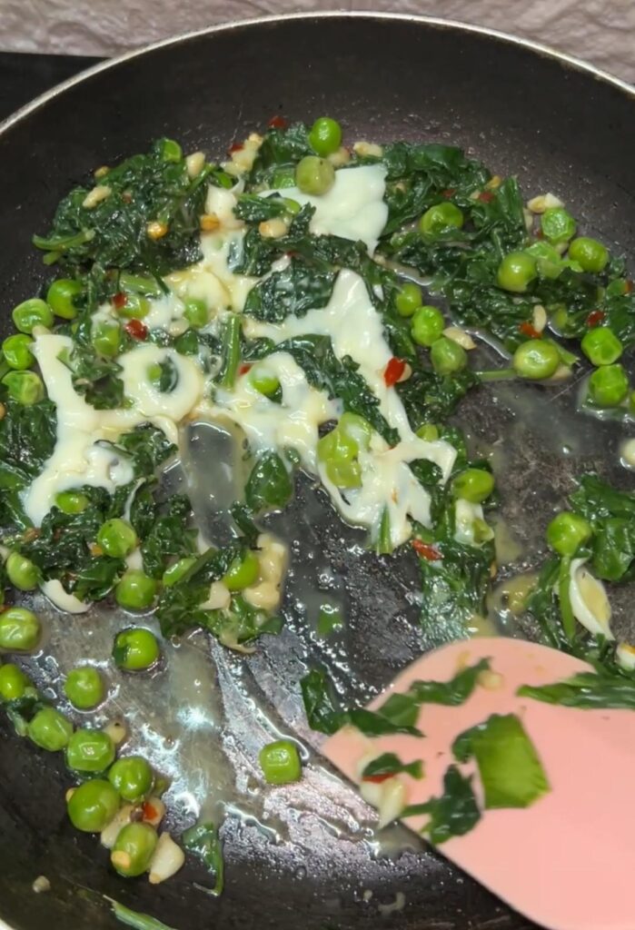 Healthy spinach toast served with cherry tomatoes and herbs