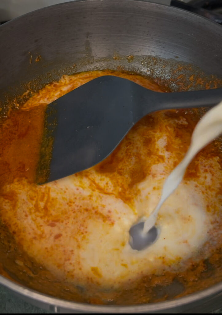 Creamy black lentil curry served with rice