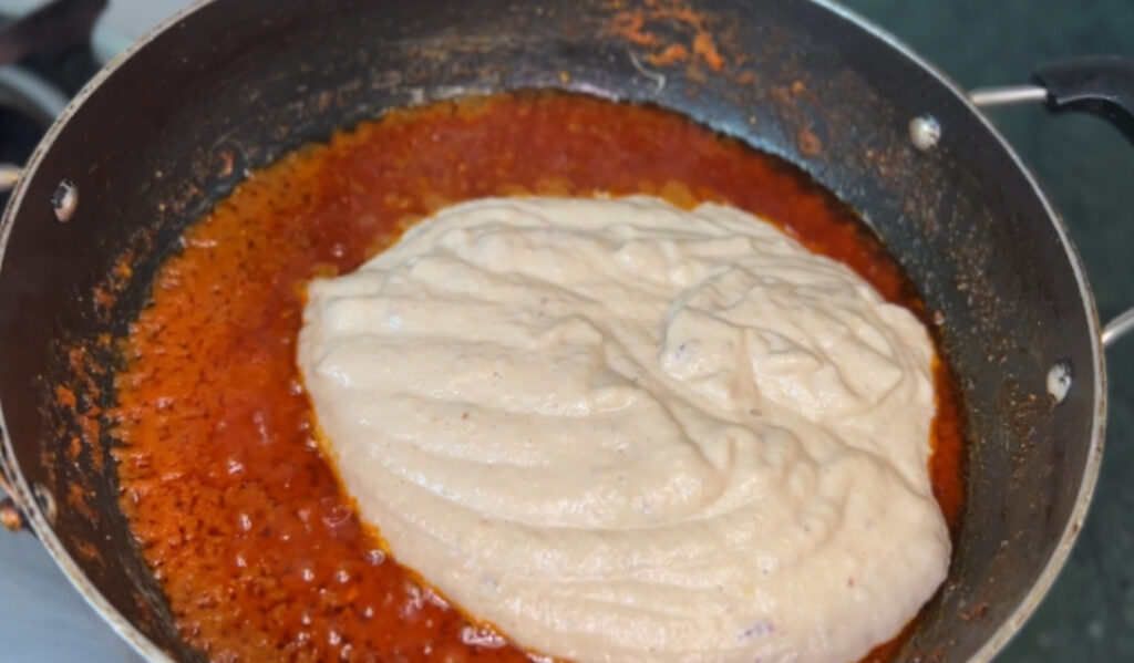 Step-by-step cooking of homemade butter chicken in a skillet