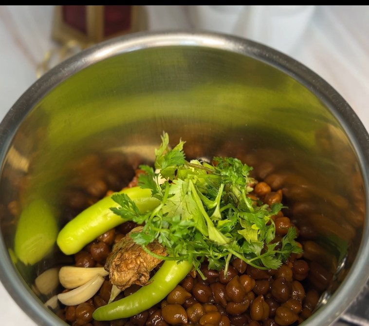 Ingredients for healthy chickpea cutlets laid out on a rustic wooden table