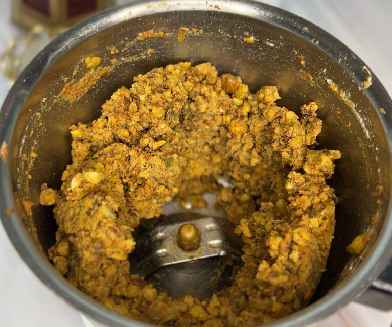 Golden-brown chickpea cutlets sizzling in a non-stick pan