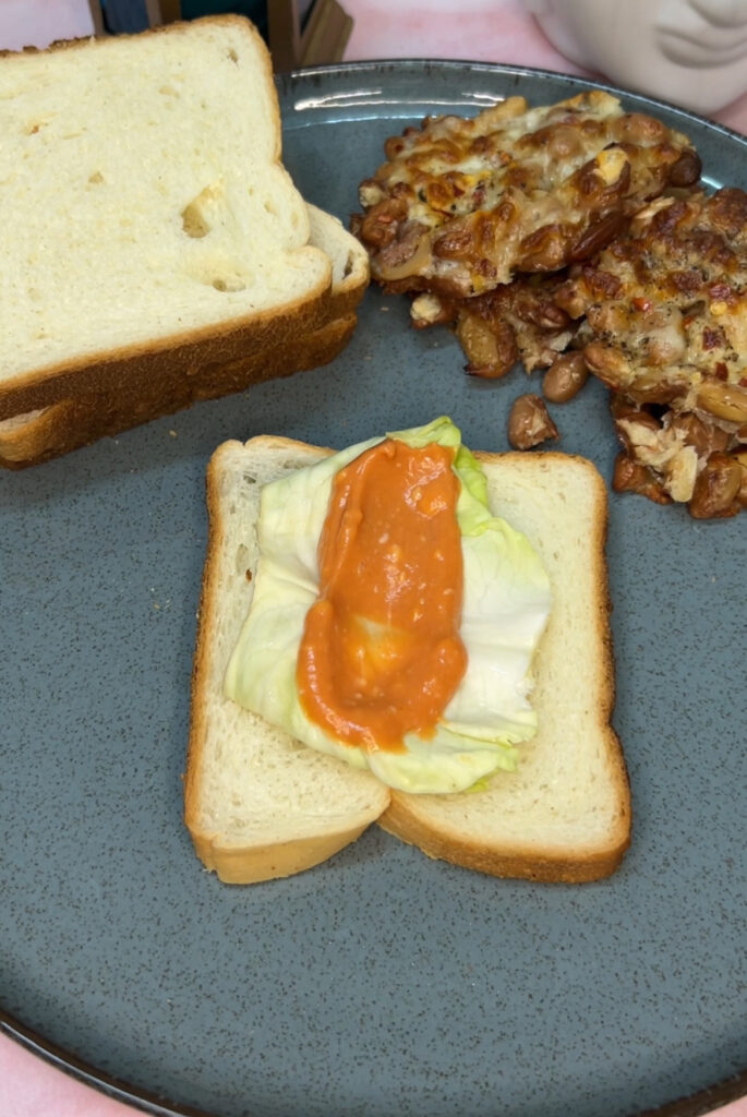 Healthy kidney bean patties sizzling on a non-stick pan