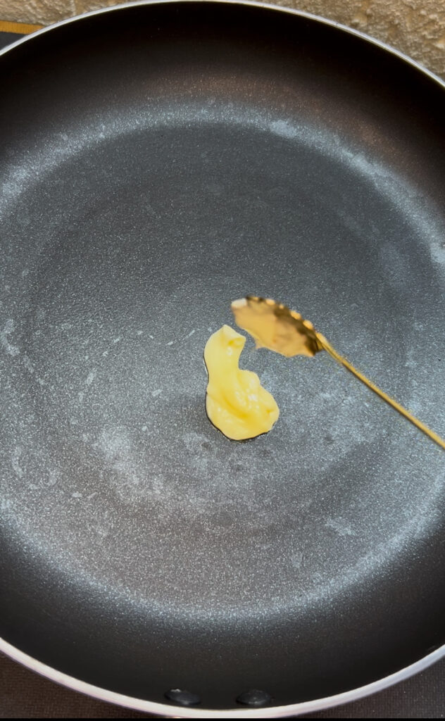 Healthy spinach omelette cooking in a nonstick pan