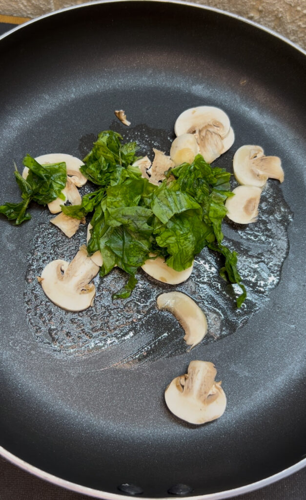 Simple spinach omelette garnished with fresh herbs