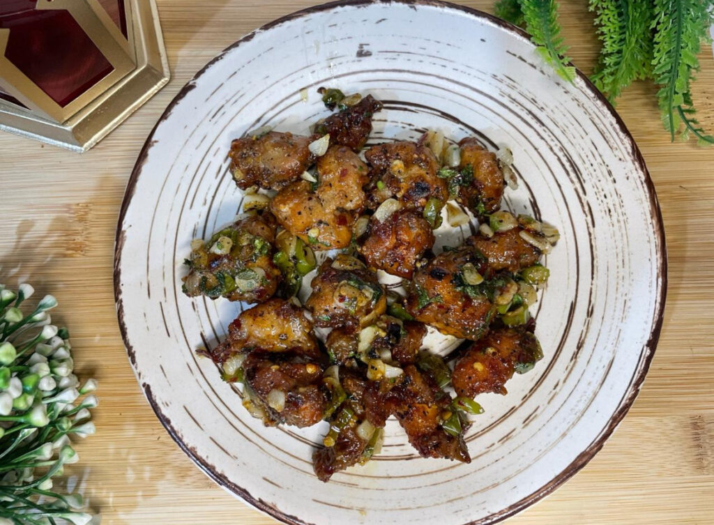 juicy garlic chicken served with fresh herbs
