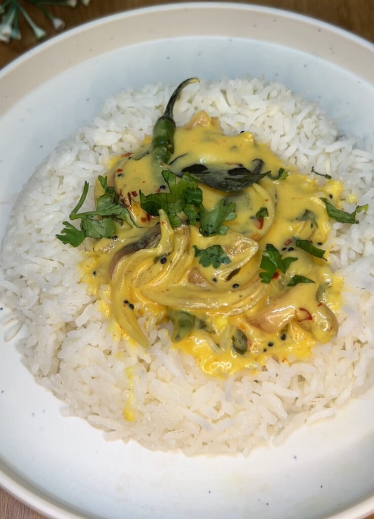 Easy yogurt curry garnished with cilantro and chili