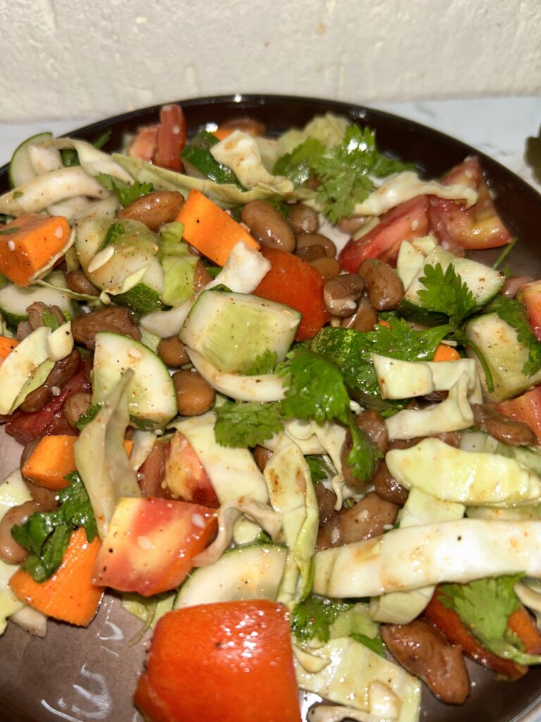 Close-up of kidney beans salad with vibrant ingredients and olive oil