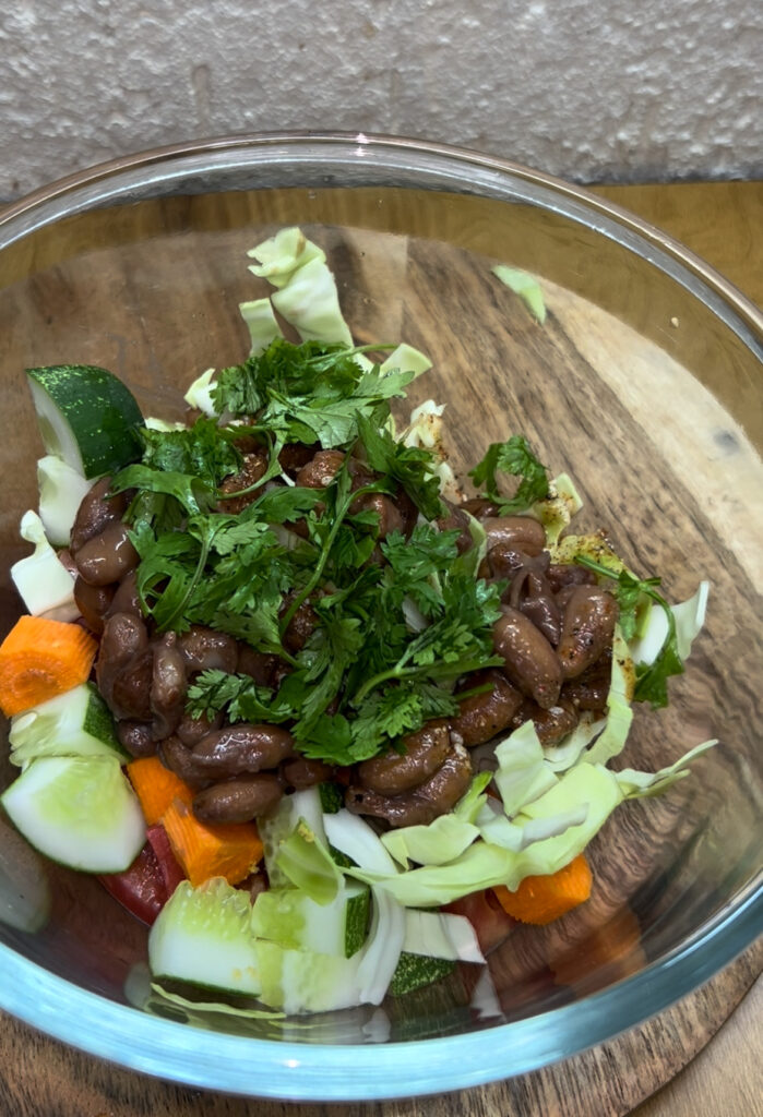 Close-up of kidney beans salad with vibrant ingredients and olive oil