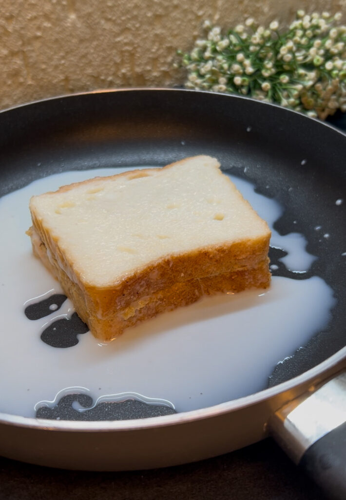 Freshly made milk toast served on a white plate