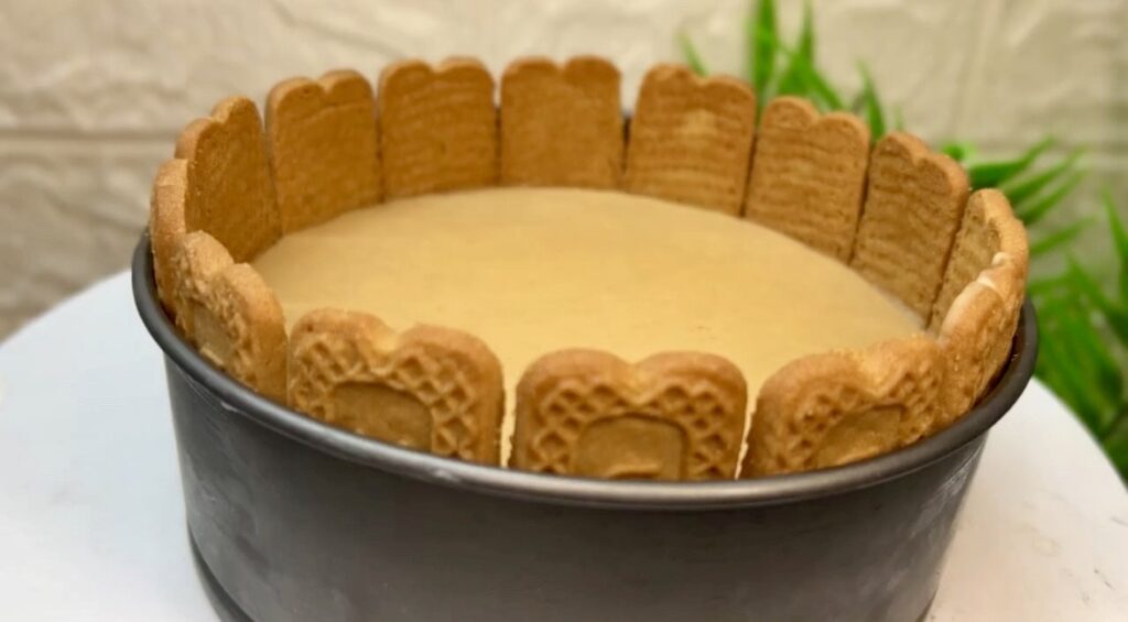Slice of creamy cheesecake recipe served with whipped cream