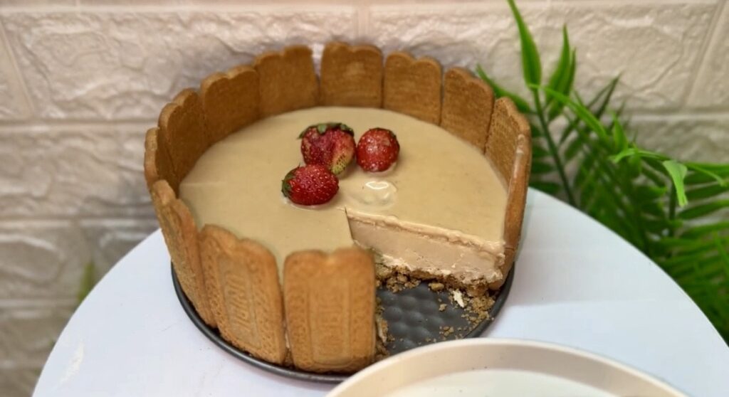 Slice of creamy cheesecake recipe served with whipped cream