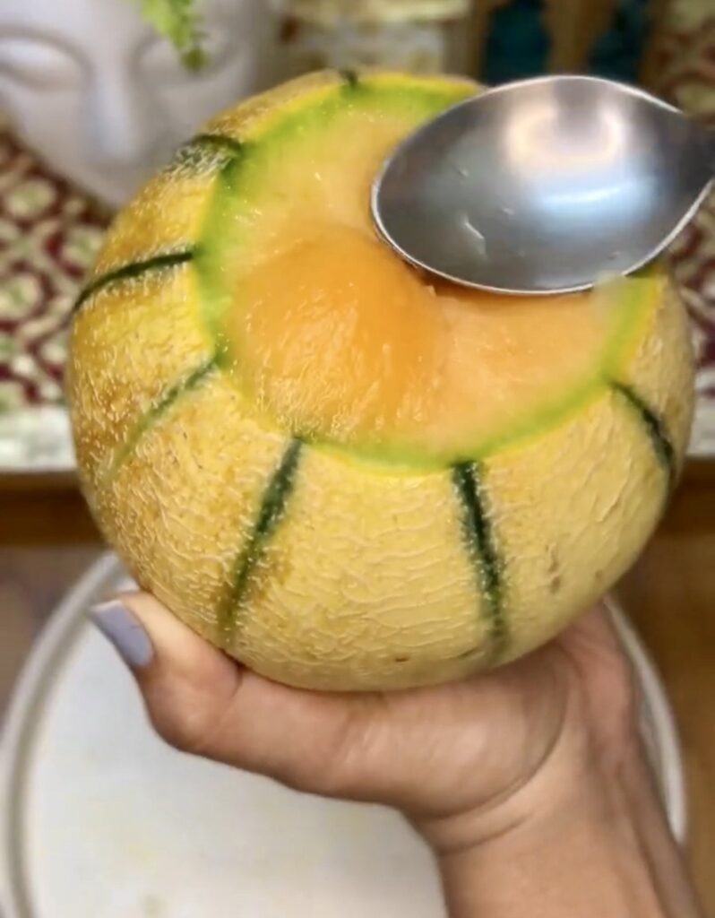 Freshly blended creamy muskmelon smoothie served with ice