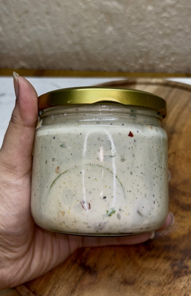 Homemade creamy cucumber salad garnished with parsley and onion