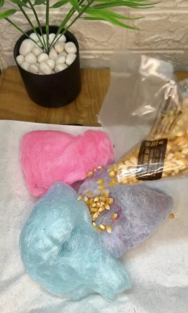 Colorful sweet popcorn mix served in glass jar
