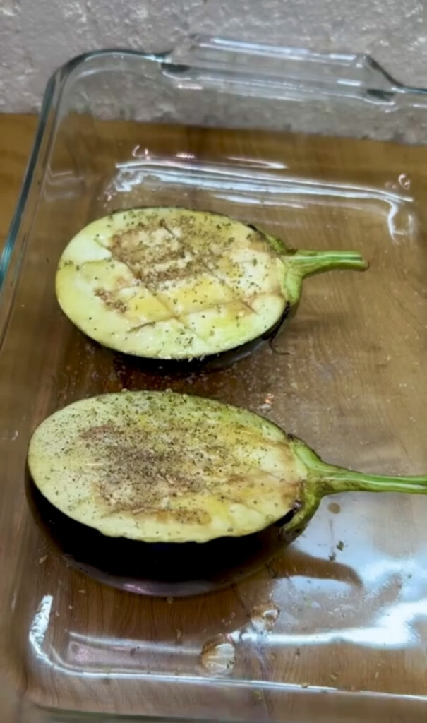 Healthy roasted eggplant garnished with fresh herbs