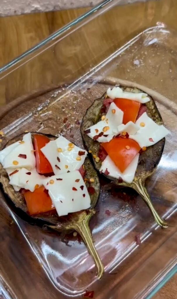 Oven-baked roasted eggplant cubes with olive oil drizzle