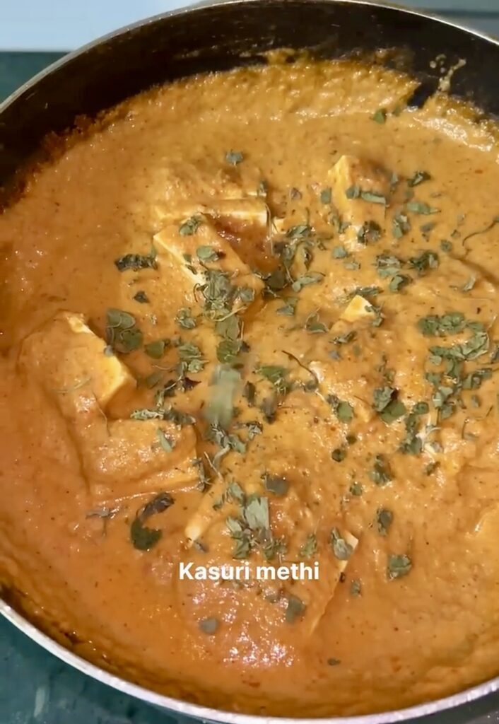 Healthy tofu curry with coconut milk garnished with cilantro