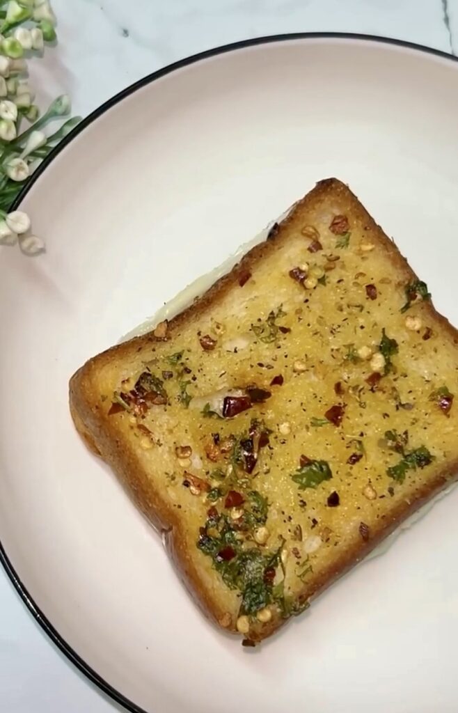 Cheesy garlic sandwich stacked on a serving tray