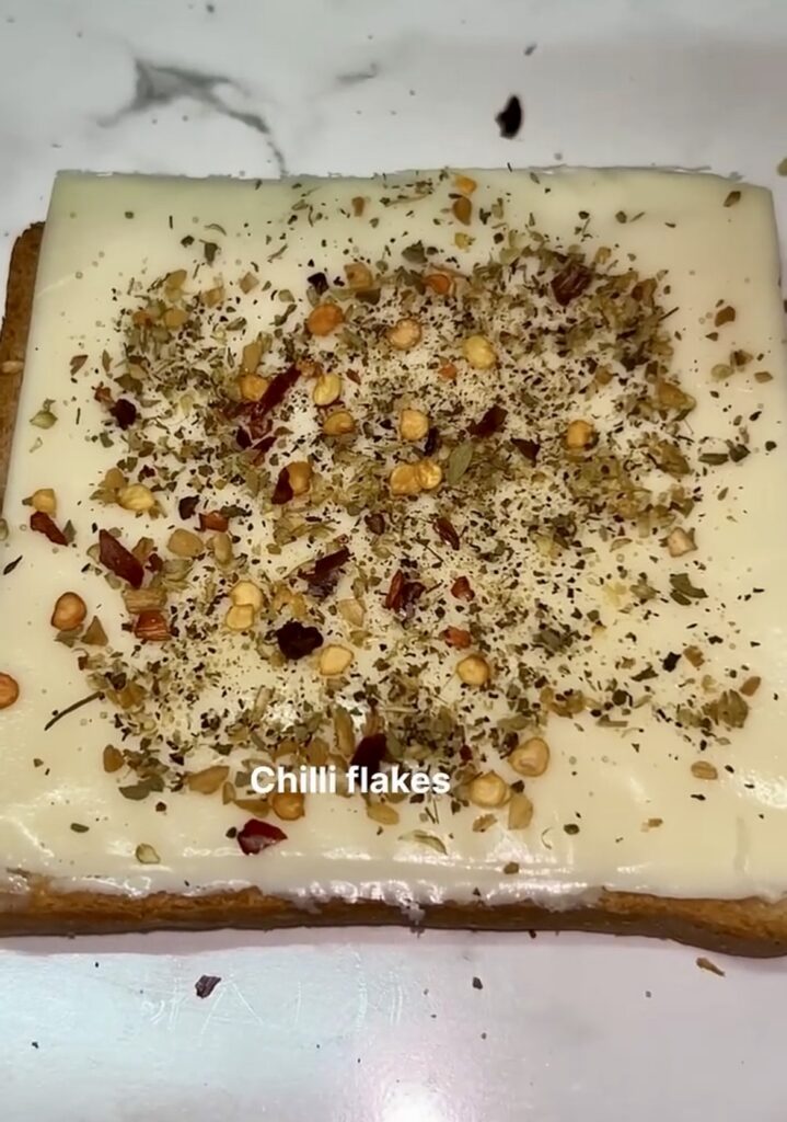 Garlic sandwich topped with parsley and butter