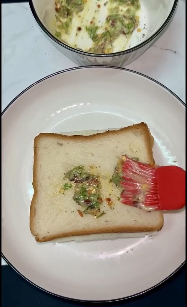 Crispy garlic sandwich cut into halves with dip
