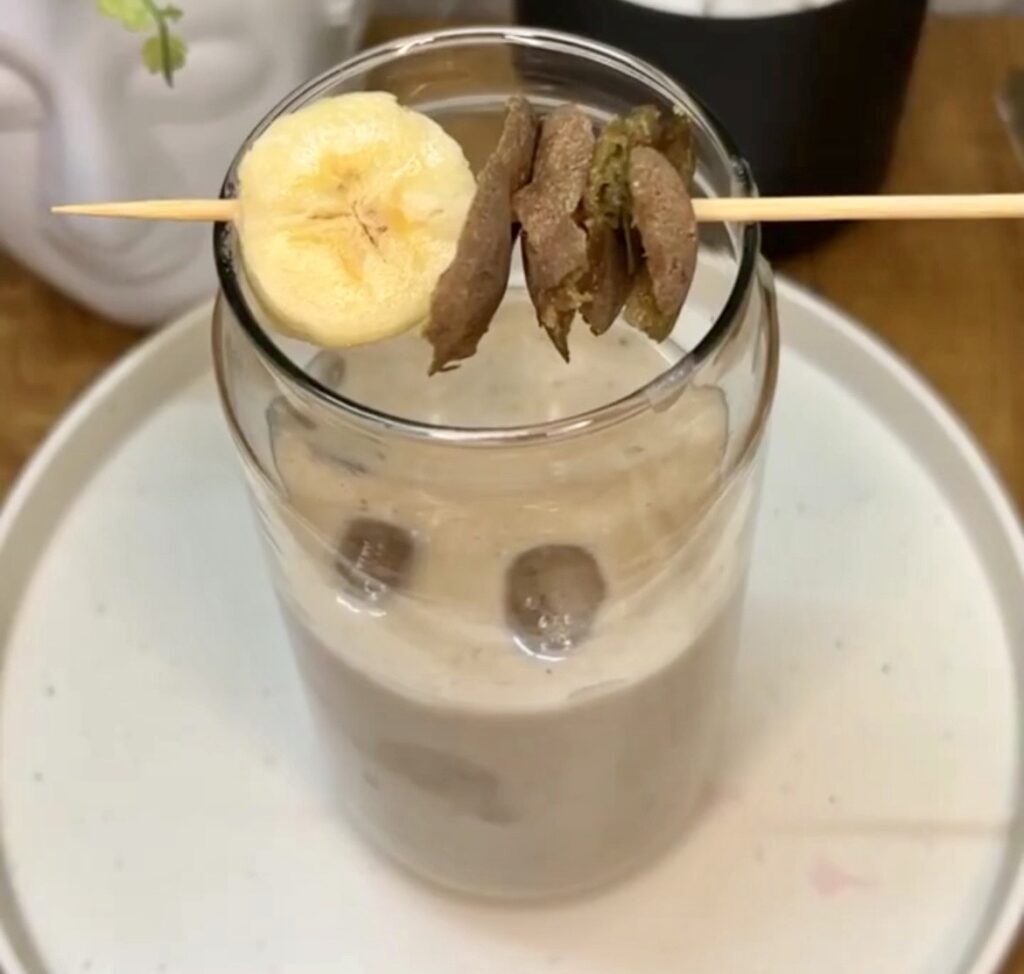 Refreshing glass of homemade sapodilla smoothie with ice