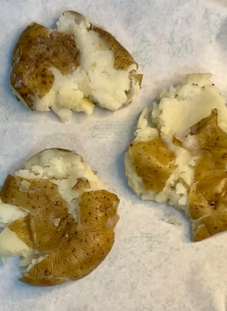 Cheesy stuffed baked potatoes served on rustic wooden table