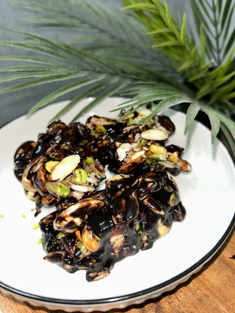 Healthy granola bars stacked on a wooden board