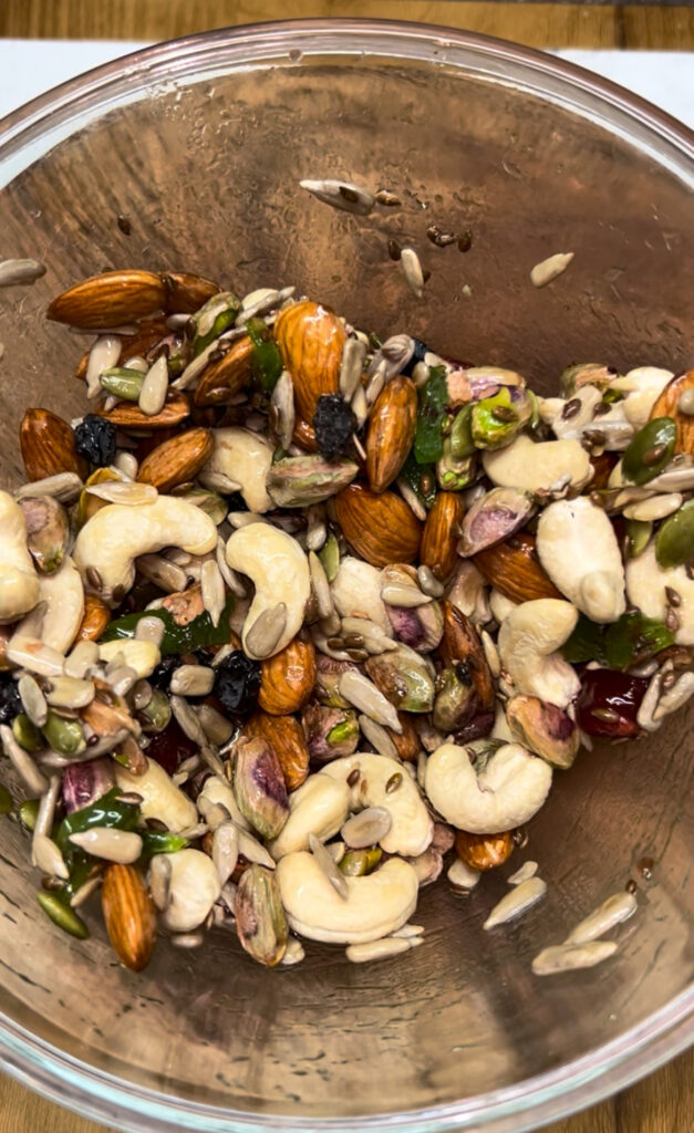 Granola bars with dried fruits and seeds on parchment paper