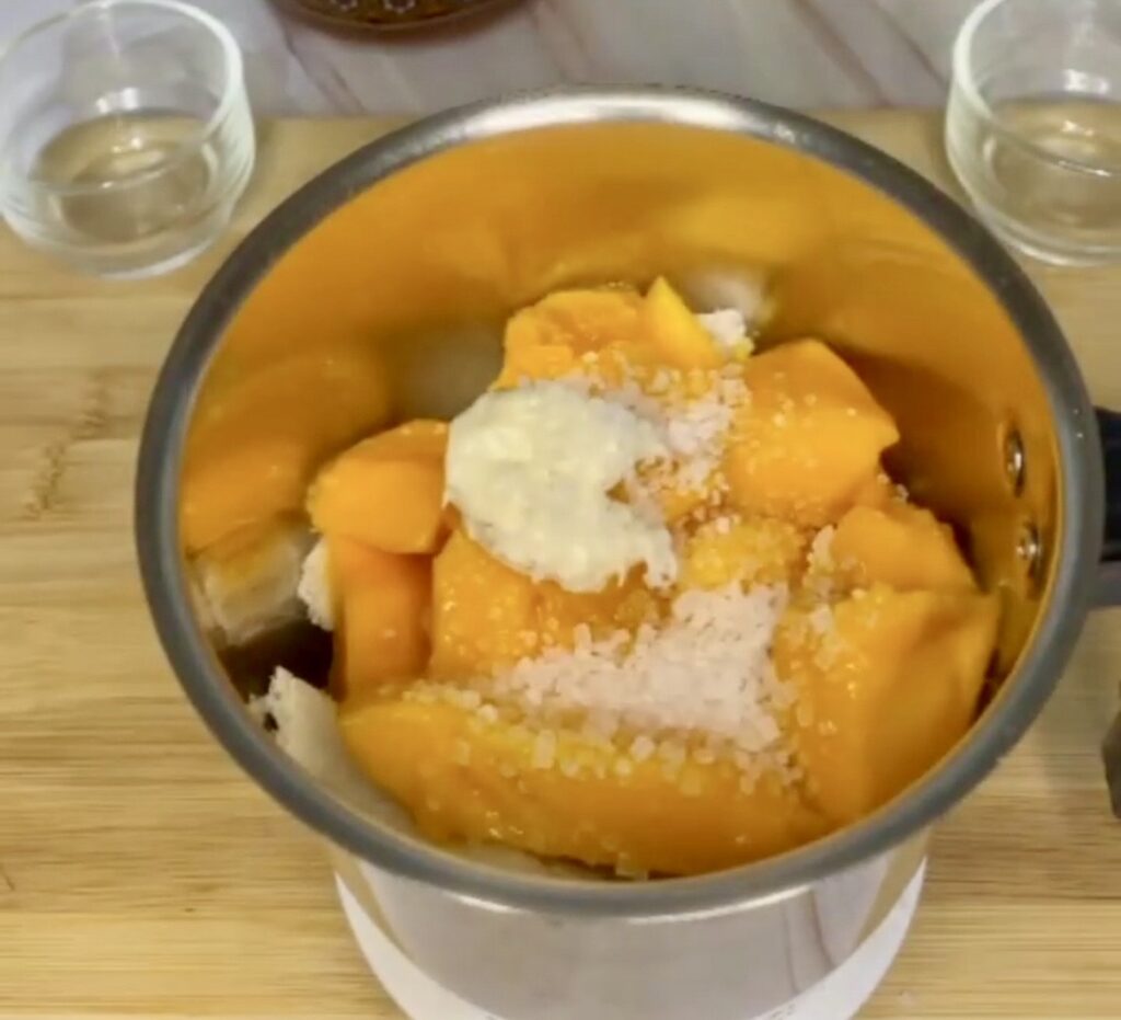 Delicious mango pudding dessert in a bowl with fruit garnish