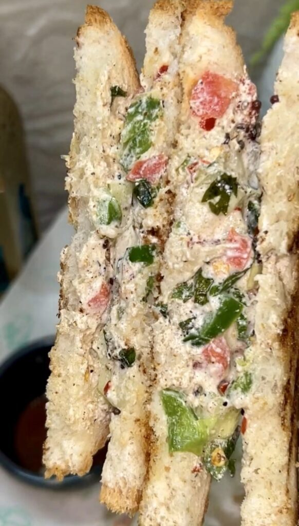 Fresh yogurt sandwich with vegetables served on whole grain bread