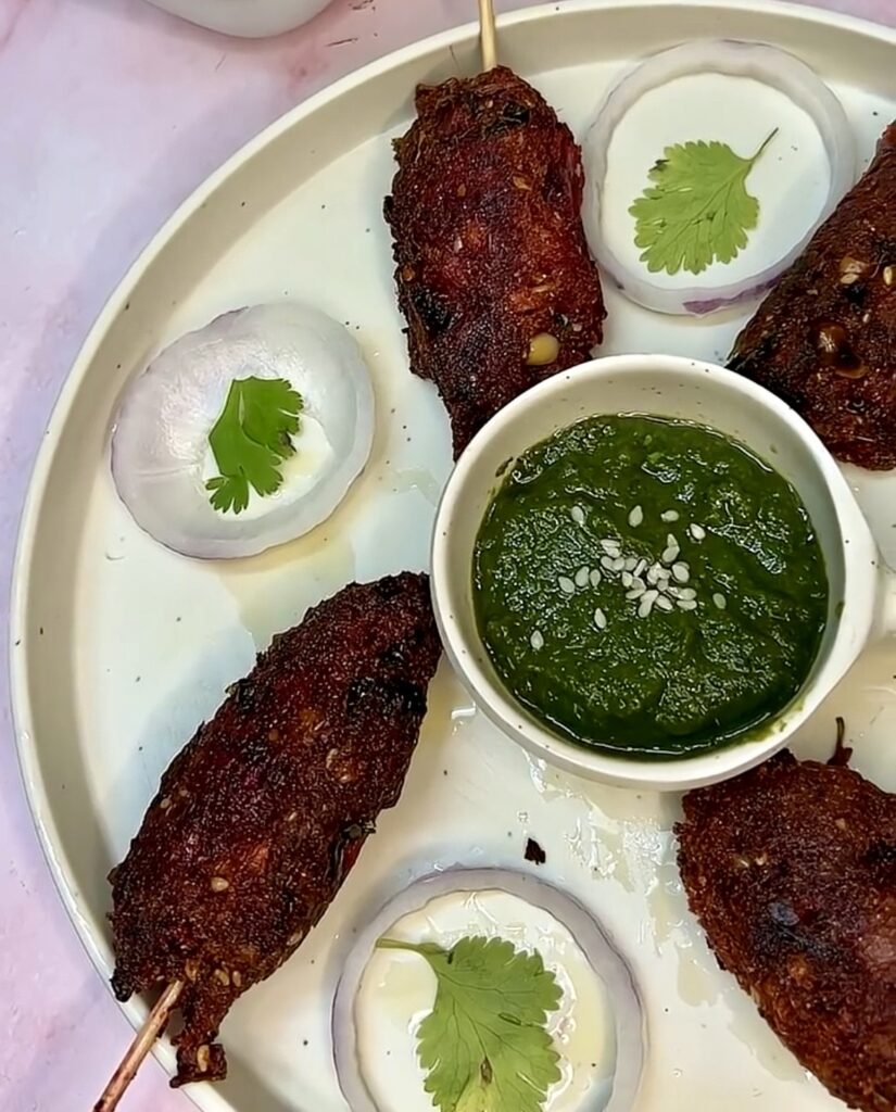 Grilled beetroot skewers with fresh herbs served on a white plate