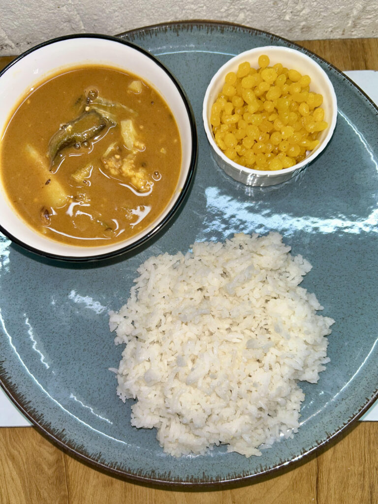 Creamy vegan curry with fresh vegetables in a bow